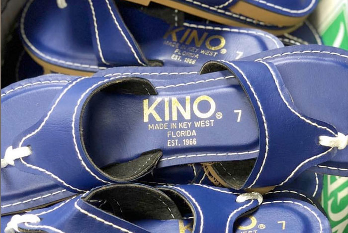 Several pairs of Kino Sandals in navy blue