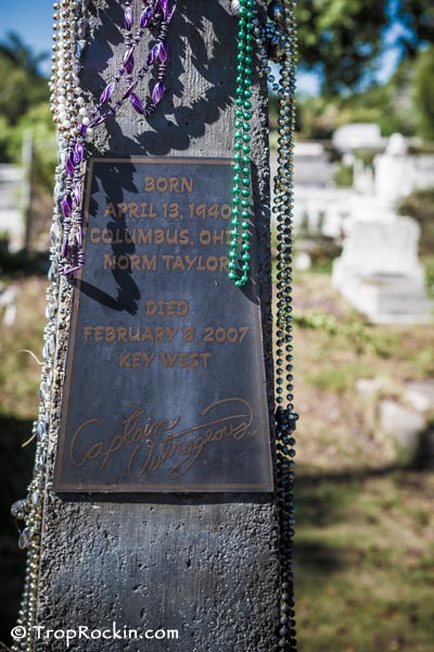 Up close view of the plaque on the grave stone that says Born April 13, 1940 Columbus Ohio. Norm Taylor. Died February 8, 2007 Key West. Captian Outrageous.