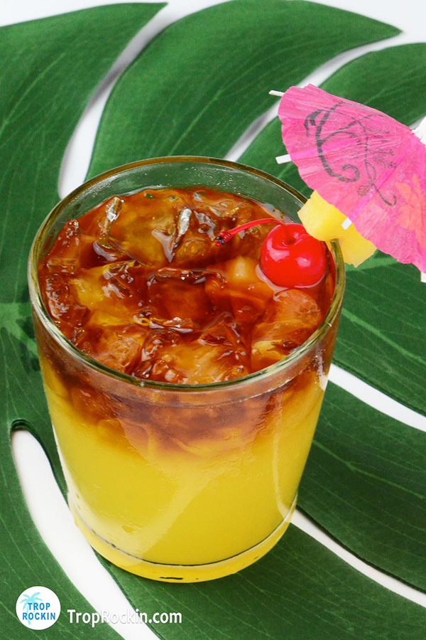 Pineapple Rum Punch with dark rum floating on top.