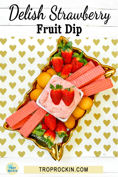 Straberry Cream Cheese fruit dip displayed on a tray of wafer cookies and strawberries.
