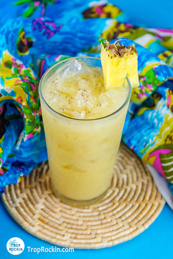 Summer cocktail recipes: Soggy Dollar Painkiller drink with a pineapple chunk for garnish