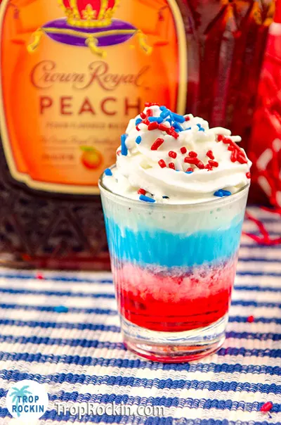 Crown Royal Peach bottle with layered red white blue shot.