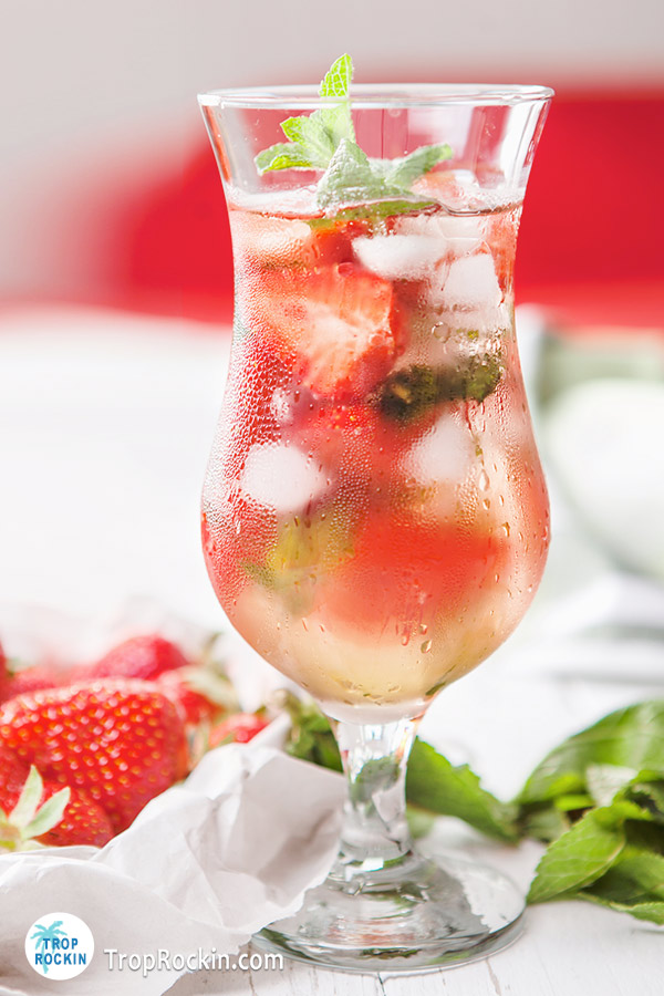 Strawberry Mojito summer cocktail in a hurricane glass