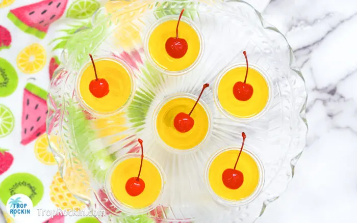 Pina Colada Jello Shots topped with Cherries.