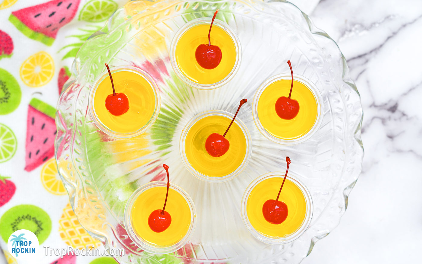 Pina Colada Jello Shots topped with Cherries.