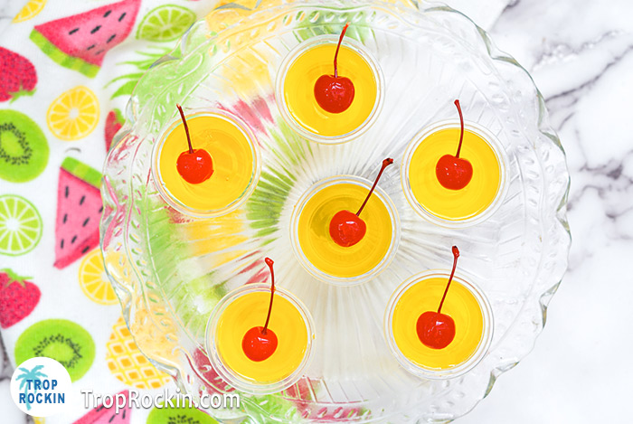 Pina Colada Jello Shots with Maraschino cherries on top. 