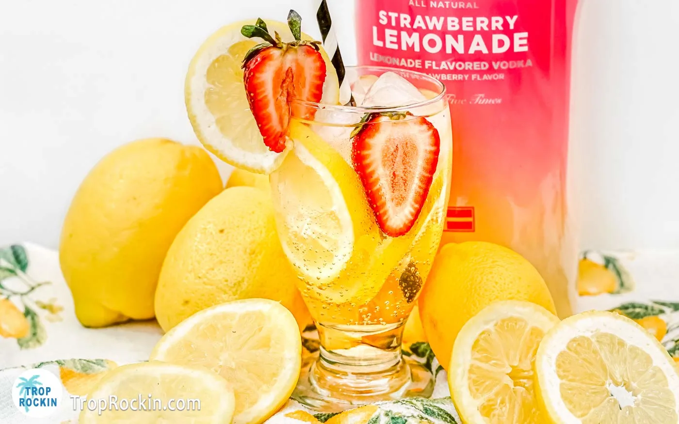 Strawberry Lemonade Vodka Drink with lemon slices and fresh strawberry garnish.
