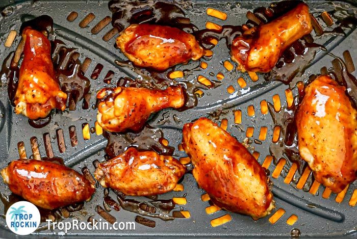 Air Fryer BBQ Chicken Wings in the air fryer basket.
