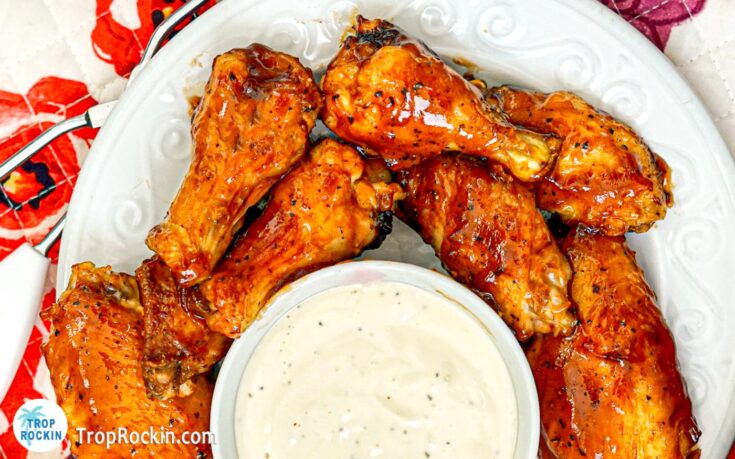 Air Fryer BBQ Chicken Wings on plate with ranch dressing dipping sauce.