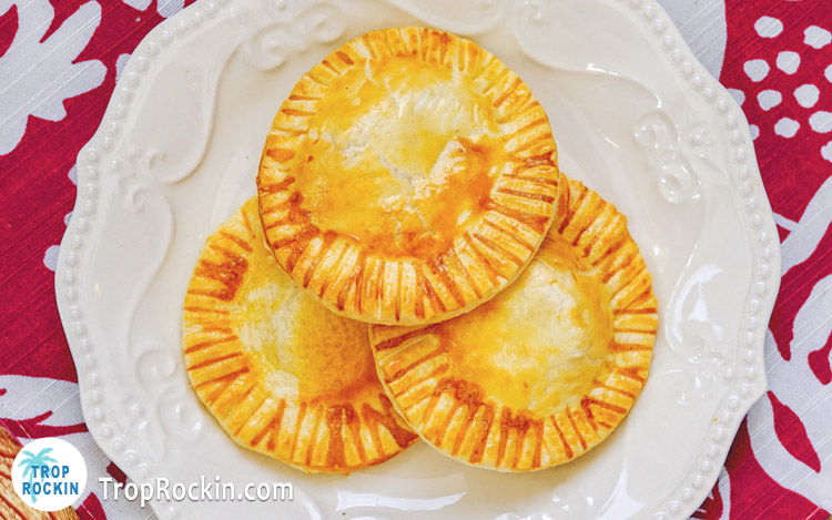 Air Fryer Apple Hand Pies stacked on plate.