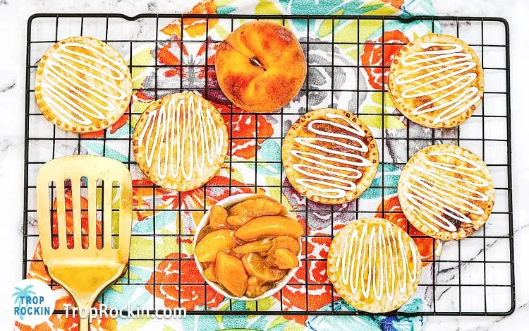 Air fryer peach hand pies with icing.