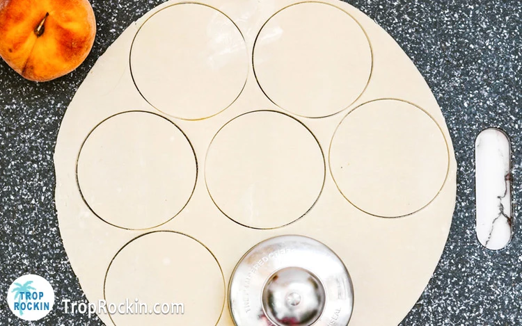 Cutting circles in pie crust.