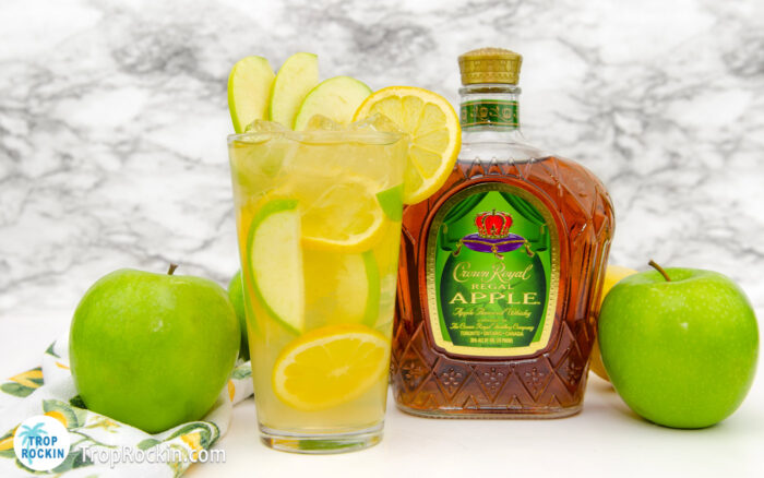 Crown Apple and Lemonade drink with Crown Apple bottle, green apples and lemons.