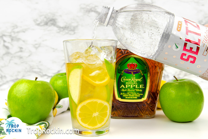 Adding Seltzer water to the Crown Royal Apple and Lemonade drink. 