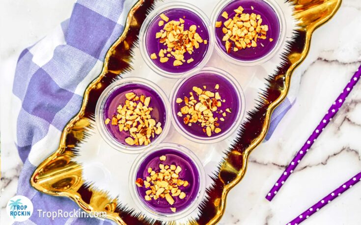 These Peanut Butter Whiskey Jello Shots are gorgeous Purple Jello Shots with peanuts on top displayed on a serving platter.