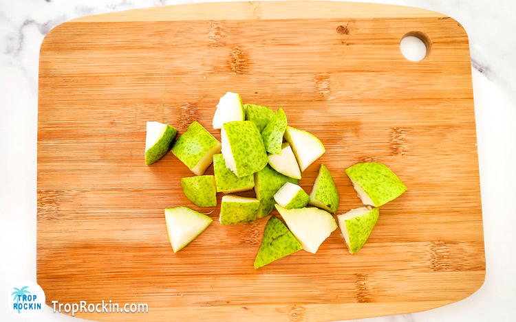 Chopped pear on cutting board.