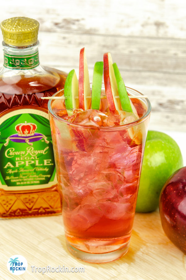 Apple Crown drink with bottle of Crown Royal Apple in background. 