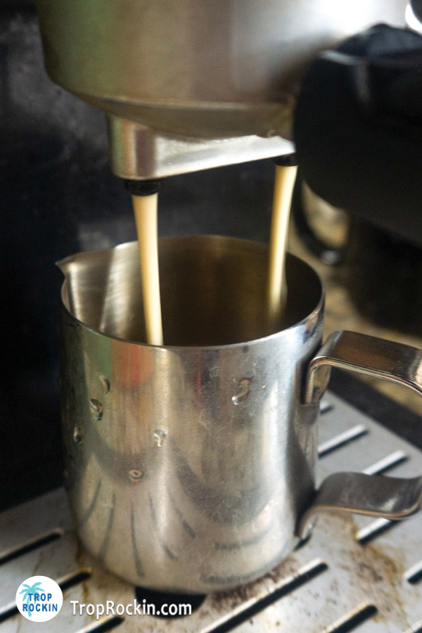 Brewing espresso using an espresso machine.