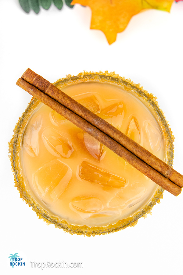Top view of Crown Royal Caramel Apple drink with cinnamon stick for garnish.