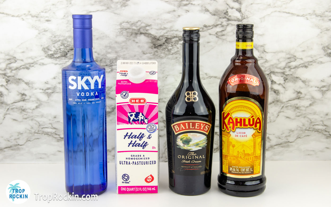 Bailey's White Russian Ingredients lined up on a counter top.