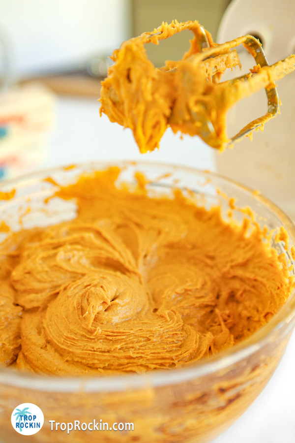Cake mix pumpkin cookies ingredients blended in a mixing bowl.