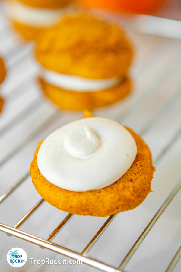 Fluff filling on top of one cake mix pumkin cookie.