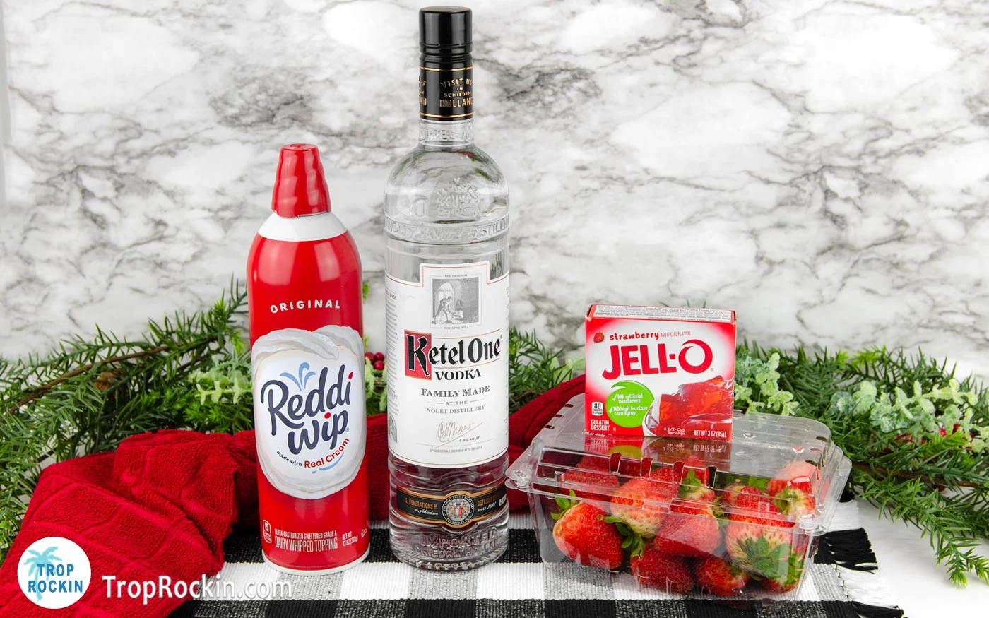 Santa Hat Jello Shots Ingredients displayed on counter top.
