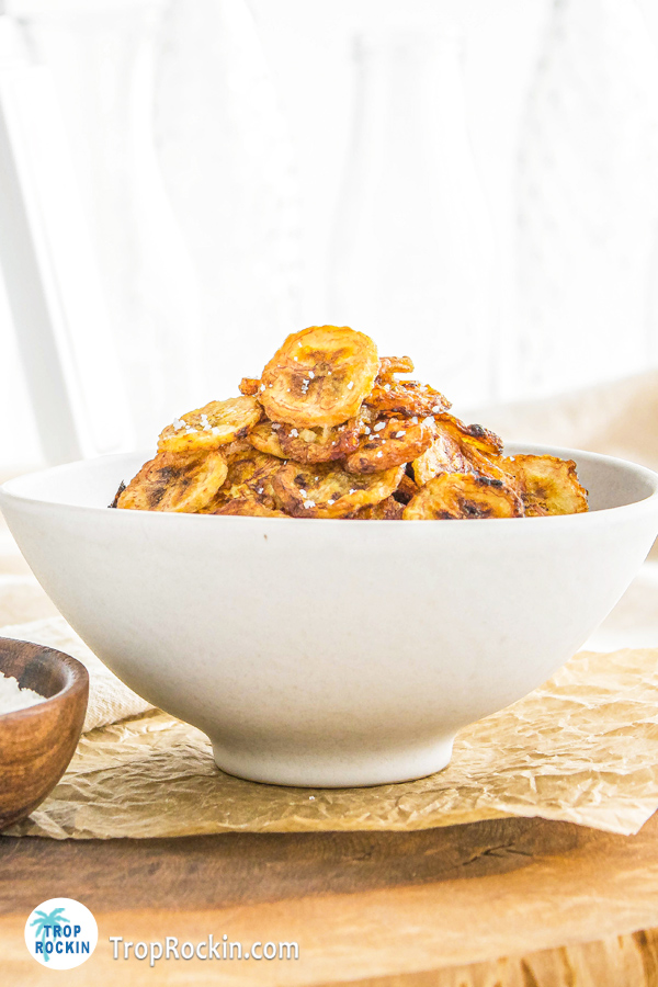banana chips in a white bowl.
