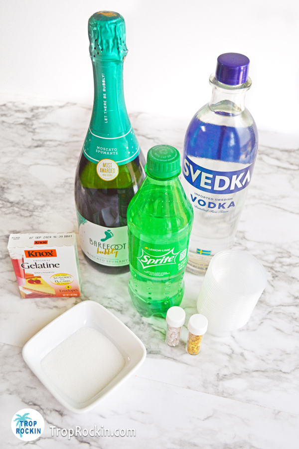 Ingredients for champagne jello shots on table.