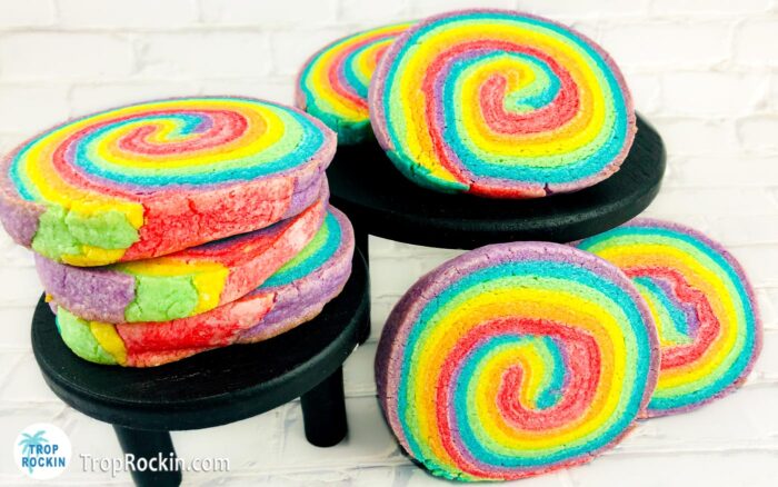 Rainbow Sugar Cookies stacked on pedestals.