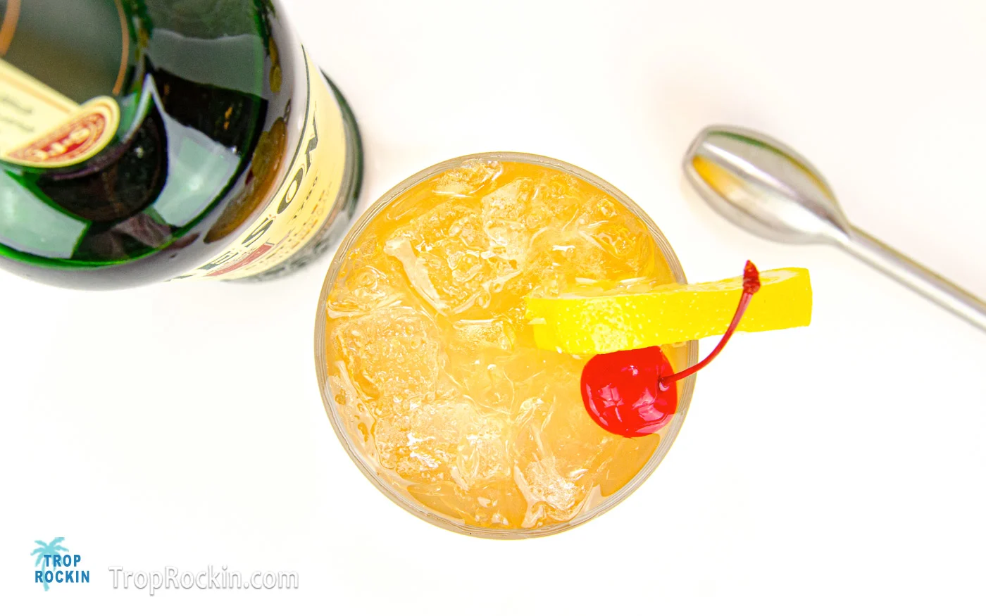 Top view of the Jameson Irish Lemonade drink with a lemon slice and cherry for garnish.