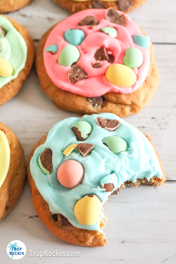 Two easter chocolate chip cookies with a bite out of one cookie.
