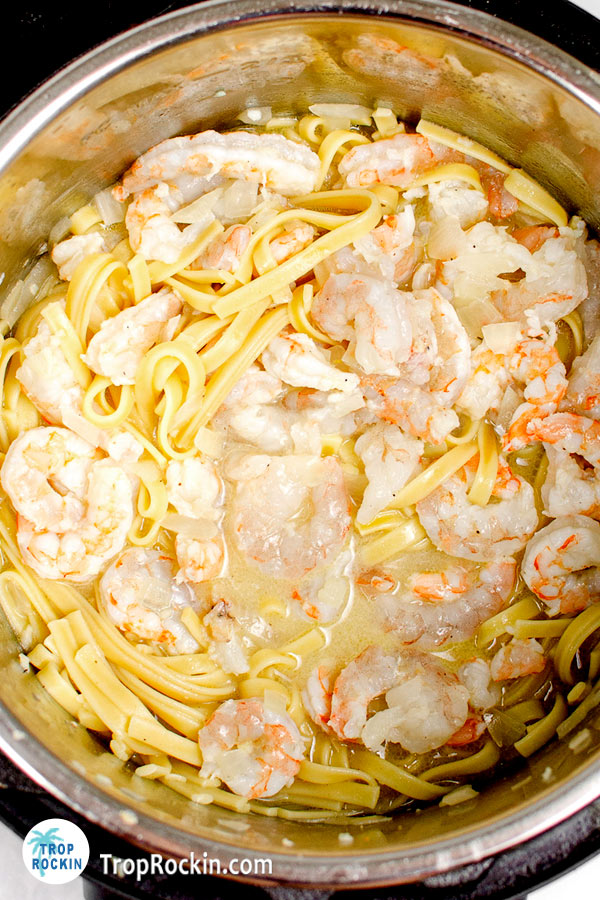 All ingredients added back into the instant pot. Shrimp mixture and noodle mixture are all combined in the instant pot.