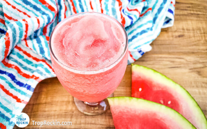 Watermelon Vodka Slush with fresh watermelon slices on counter top.