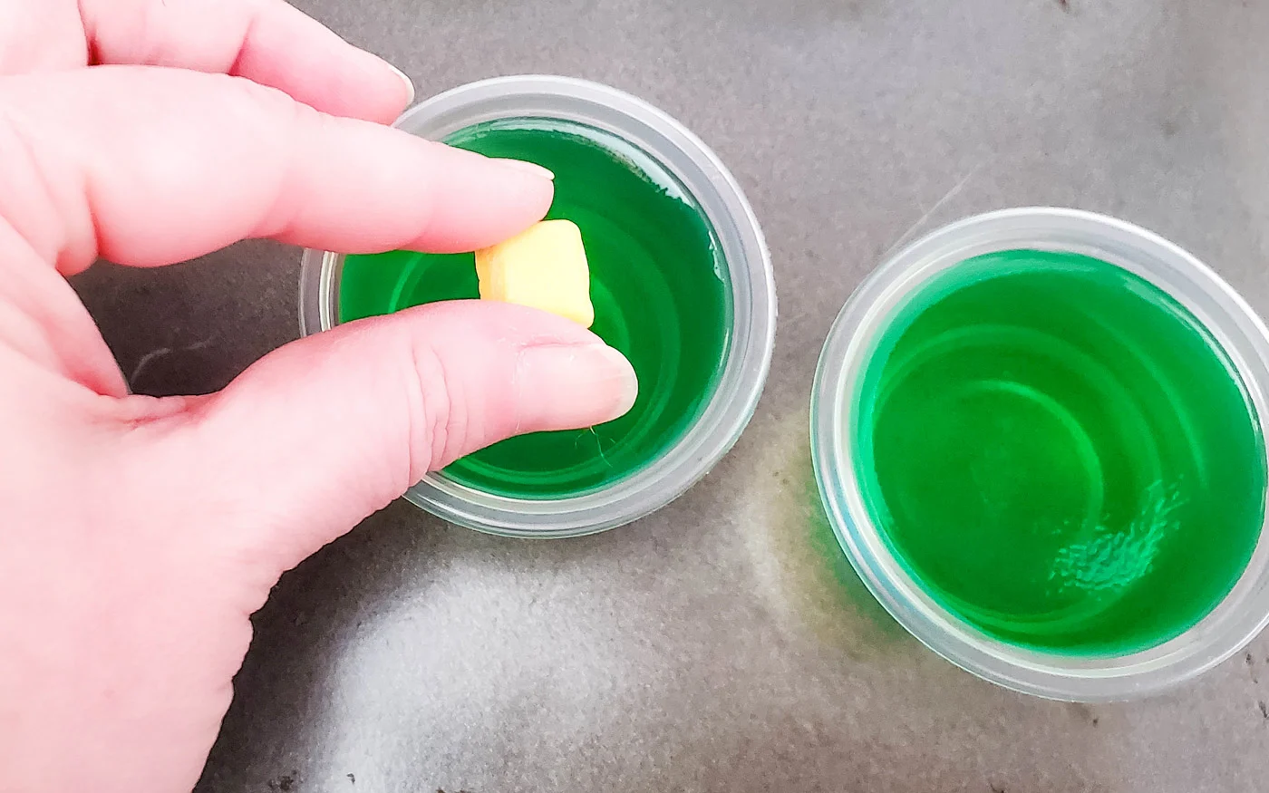 Adding a yello starburst candy on top of the jello shots for garnish.