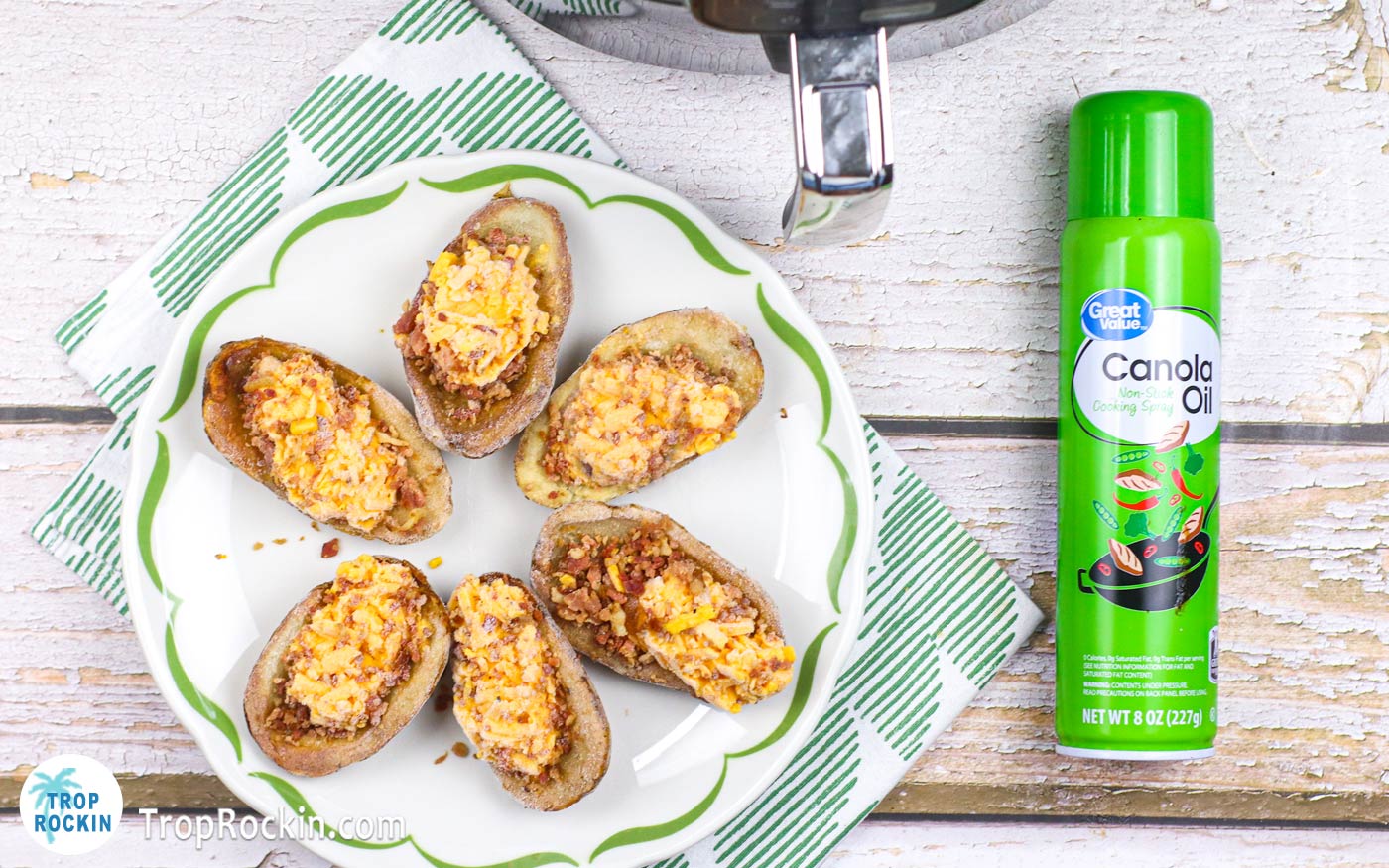 Six frozen potato skins on a plate and a can of canoloa non-stick cooking spray.