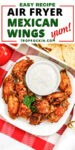 Air fryer Mexican Chicken wings on a white plate with a bowl of ranch dressing. Text overlay with recipe title.