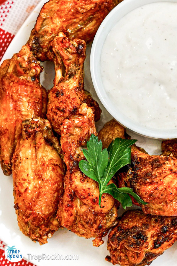 Close look at air fried mexican wings with ranch dipping sauce.