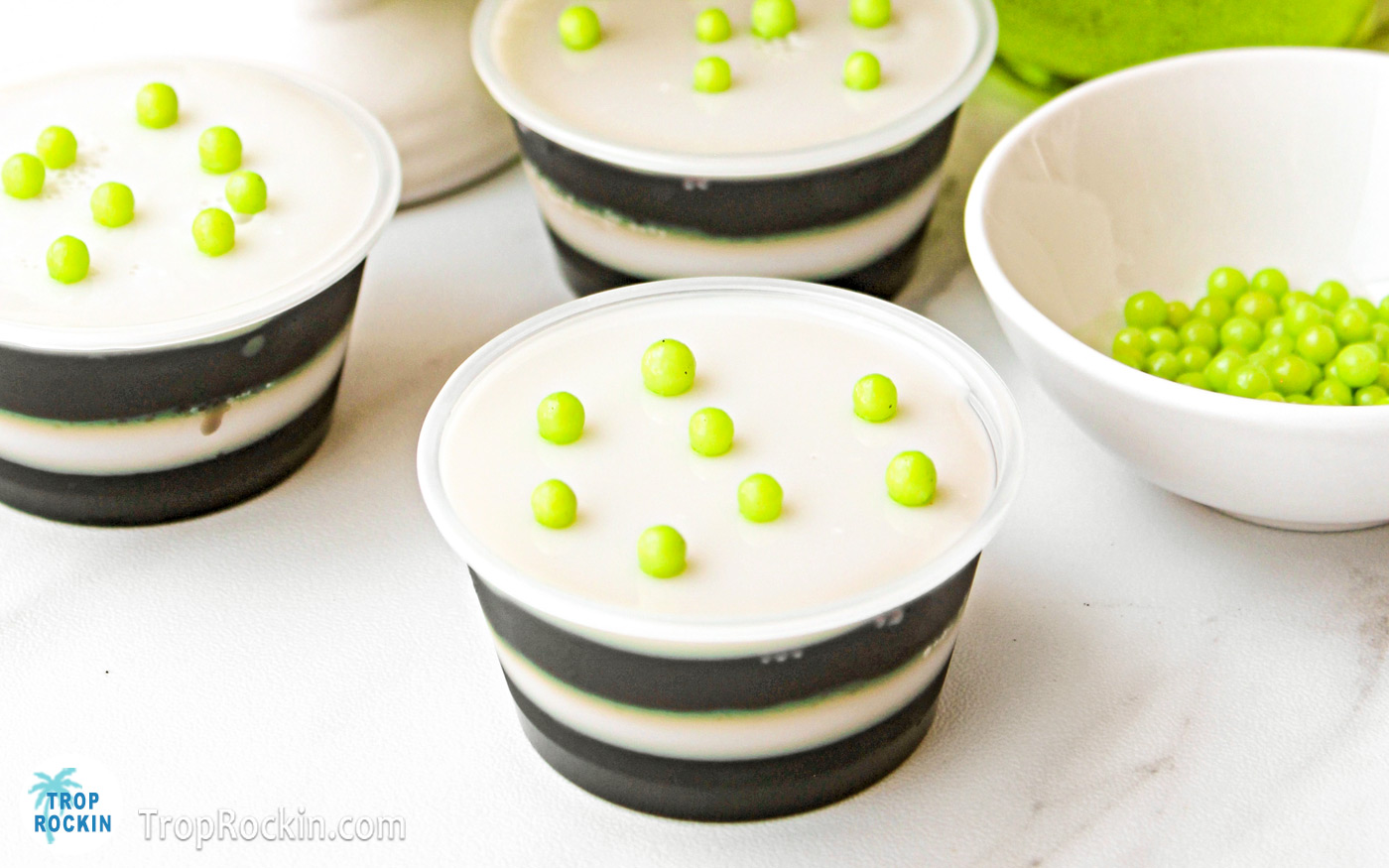 Black and white striped jello shots with lime green sprinkles on top to represent Beetlejuice.