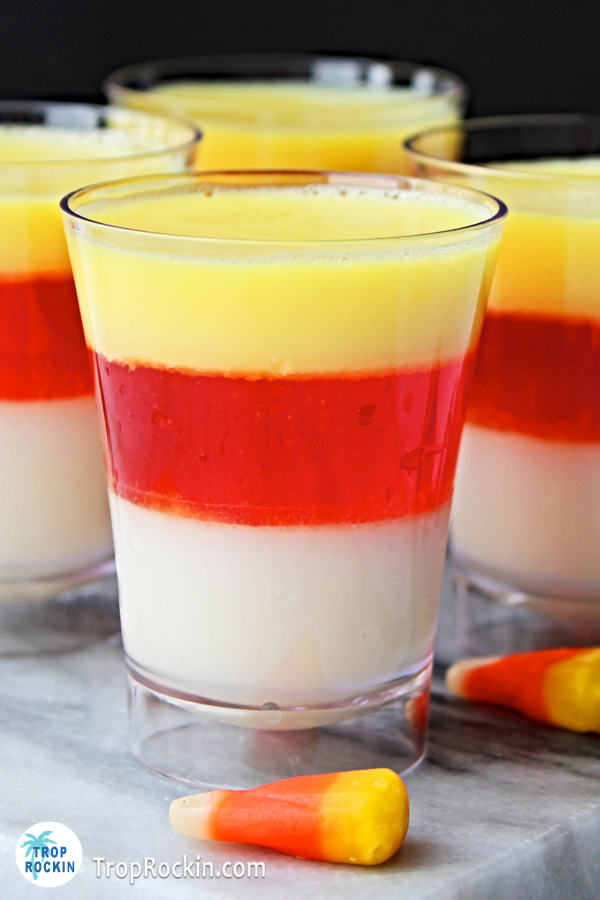 Halloween candy corn jello shot from side view showing all layers clearly.