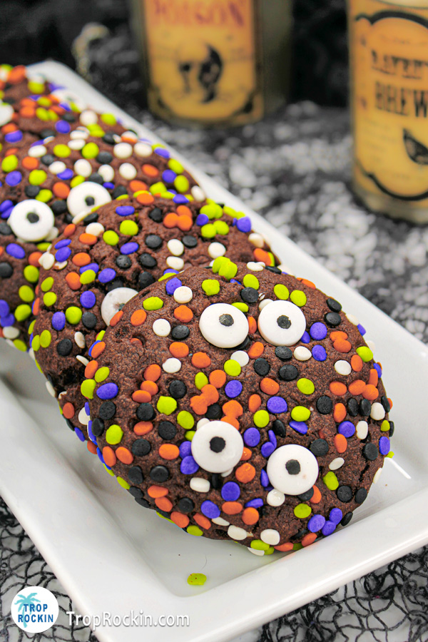 Chocolate Halloween Cookies with sprinkles and candy eyeballs on a serving platter.