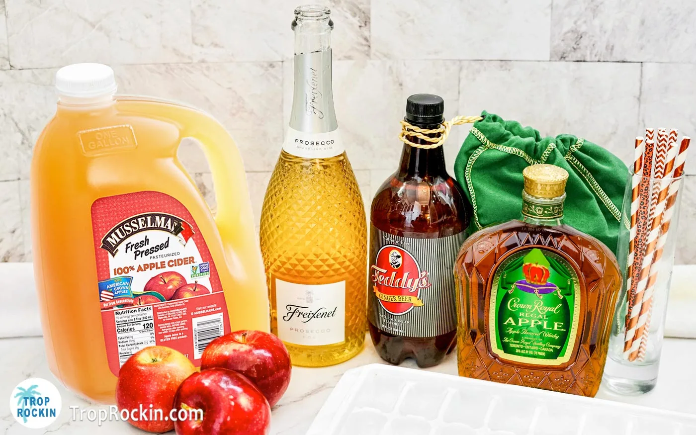 Apple Cider Whiskey Punch Ingredients displayed on counter top.