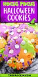 Close up Hocus Pocus Cookies with tri-color cookie dough (purple, green and orange) with white choclate chips and sprinkles. Text overlay with recipe title for sharing to social media.