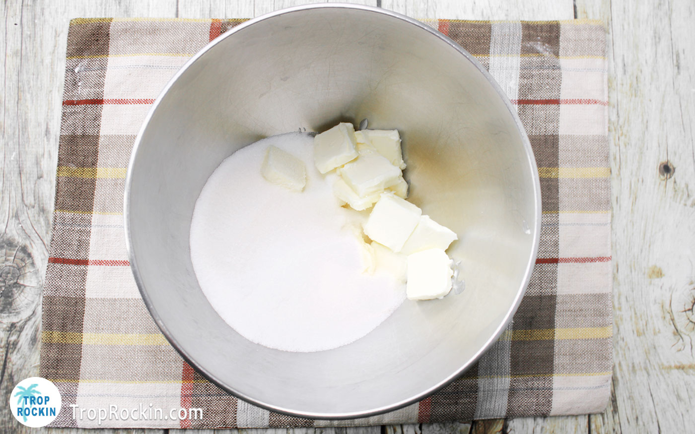 Cubed butter and sugar in a a large mixing bowl.