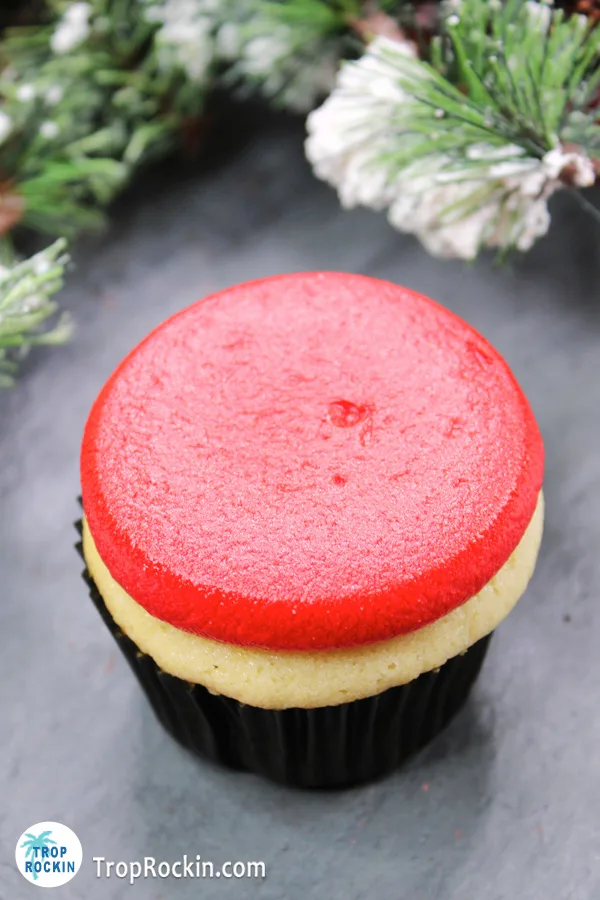 Santa cupcake with flat red frosting on top of the cupcake.