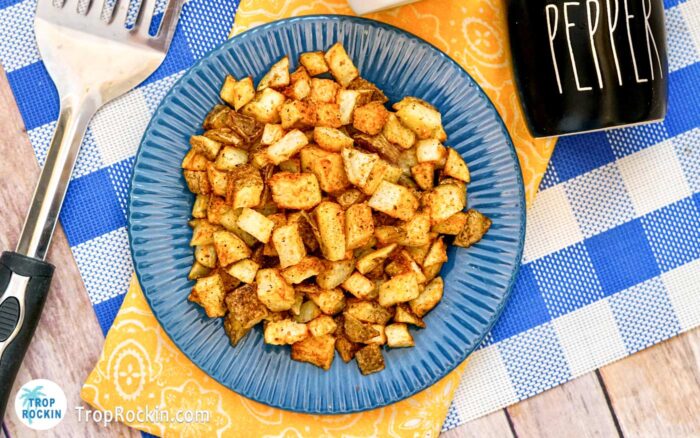 Air Fryer Diced Potatoes on a blue plate.