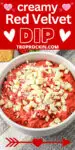 Bowl of red velvet dip with withe chocolate pieces on top. Text overlay above with recipe title for sharing to social media.