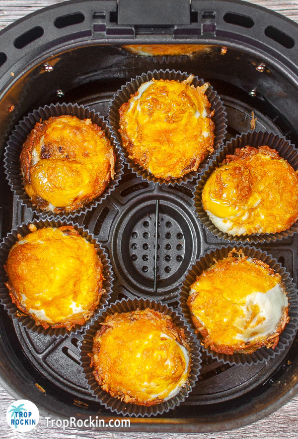 Completely cooked air fryer bites in the air fryer basket.