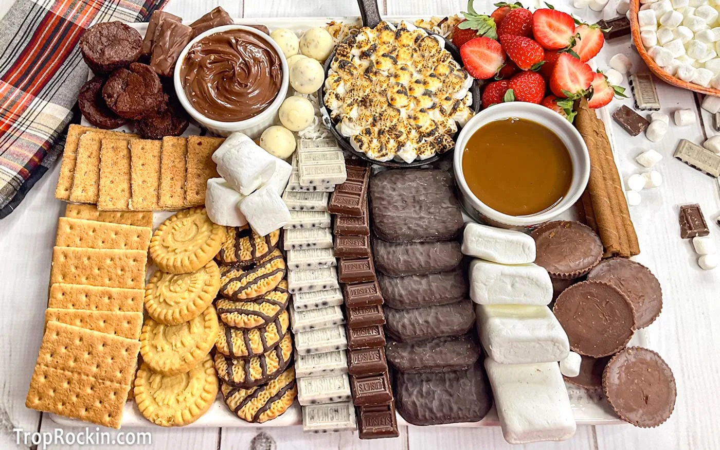 Smores charcuterie board with a variety of sweets on top of a large platter.