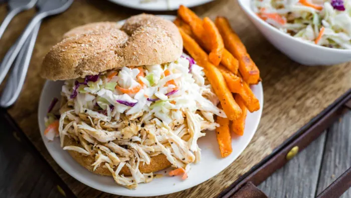 Shredded chicken sandwiches with slaw on top.